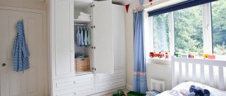 White wardrobe with an open door in a boy's room