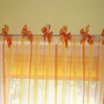 Curtains with ties add a touch of romance to the decor