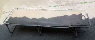 Old worn out Soviet folding bed