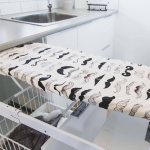 built-in ironing board in the kitchen